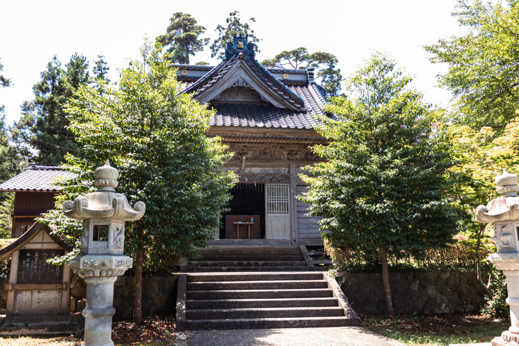 The shrine building that sits prominently at the front.